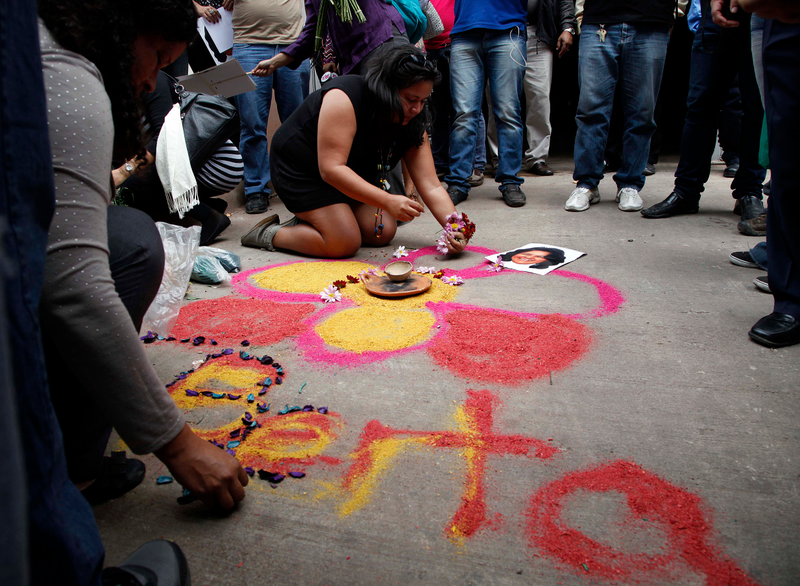 People make an offering in honor of honor slain Honduran indigenous leader and environmentalist Berta Caceres outside the coroners office in Tegucigalpa, Honduras. (AP Photo/Fernando Antonio)AP